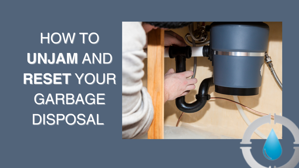 Hand using an S-shaped wrench to manually rotate the blades in the bottom center of a garbage disposal.