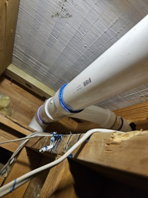 New coupling installed on the 3-inch kitchen waste line, fully sealed to stop leaks and restore proper drainage.