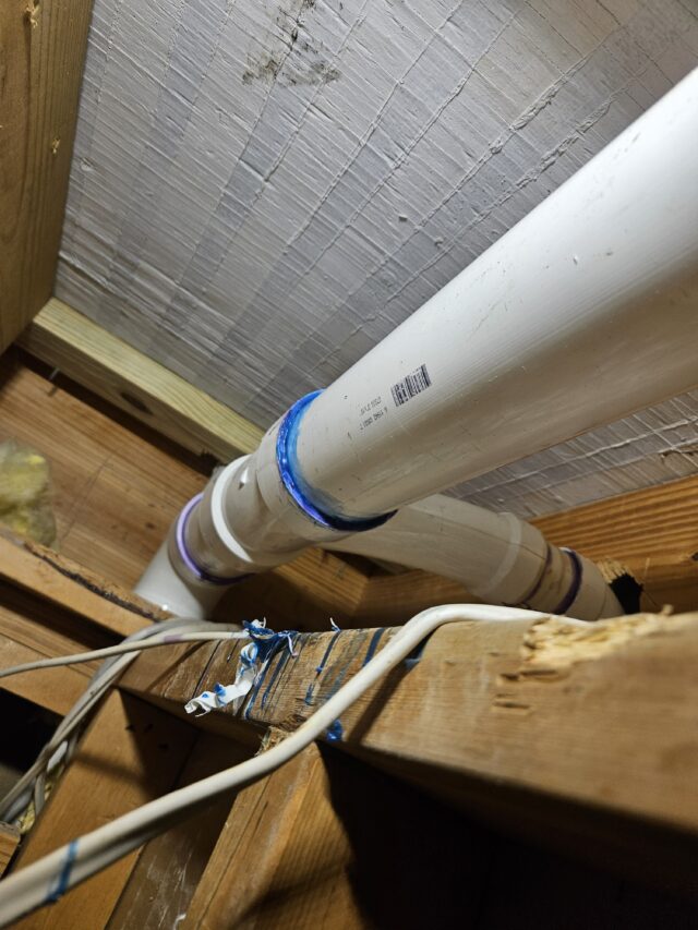 New coupling installed on the 3-inch kitchen waste line, fully sealed to stop leaks and restore proper drainage.