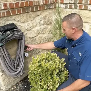 Checking the pressure of this home's water.