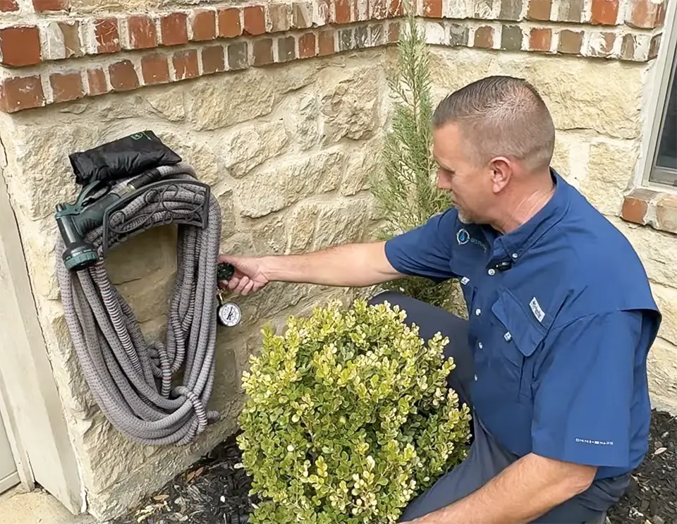 Checking the pressure of this home's water.