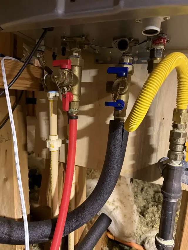 Corroded Rinnai tankless connections and stressed gas flex line.