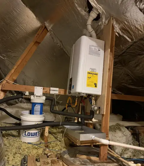 Final Navien tankless install with hard water filter and clean gas lines.