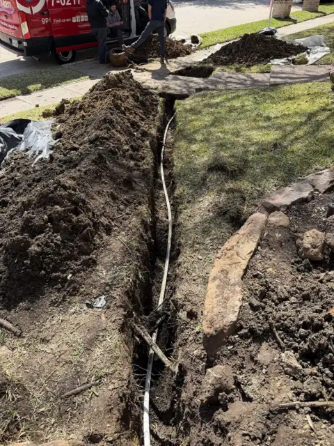 Exposed broken water line trench repair Frisco TX