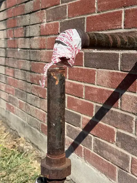 Split gas riser ball valve discovered by GPS Plumbing during an exterior gas-line repair in Northridge, Frisco, Texas.