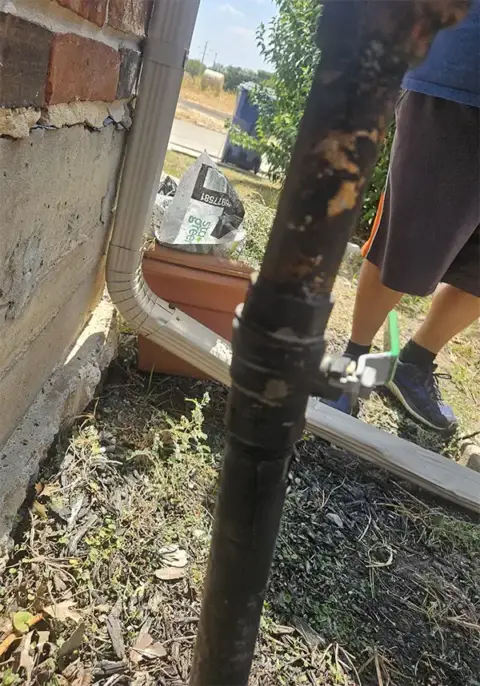 Existing exterior gas riser before replacement at a home in Plantation Resort, Frisco, TX.