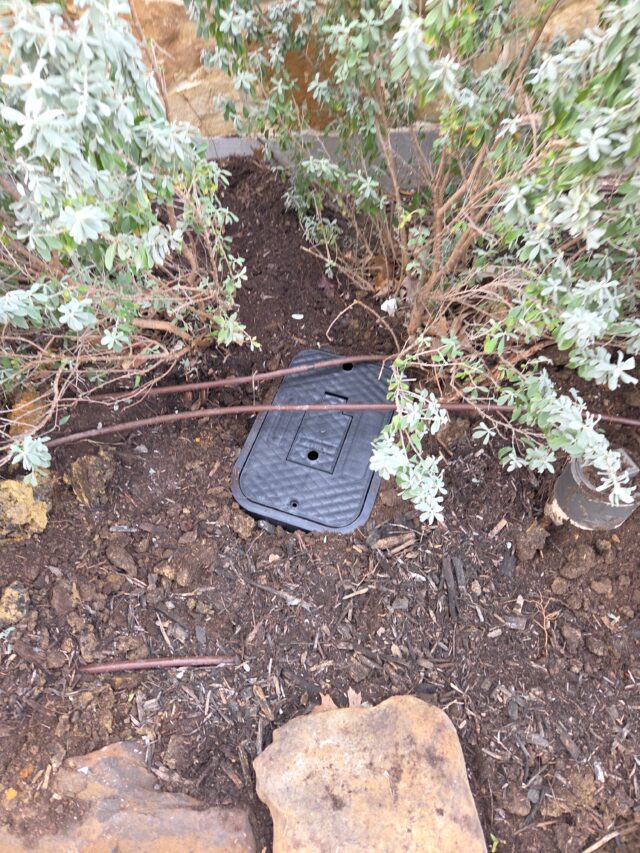 Pressure Reducing Valve (PRV), where water pressure is regulated before entering the house.