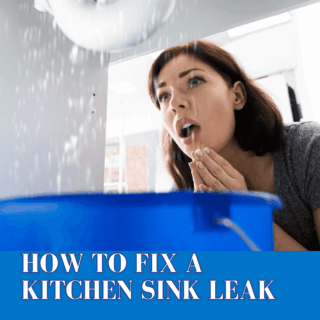 Leaking pipe under kitchen sink causing water damage