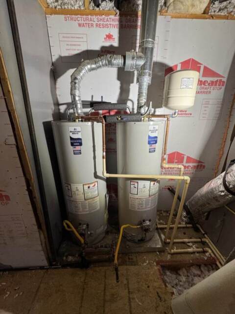 Replaced two tank water heaters with new Bradford White units