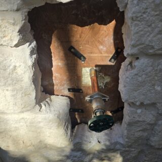 Replaced hose bib after the original broke inside the wall, installing a new drop-ear fitting and securely mounting it for long-term durability.