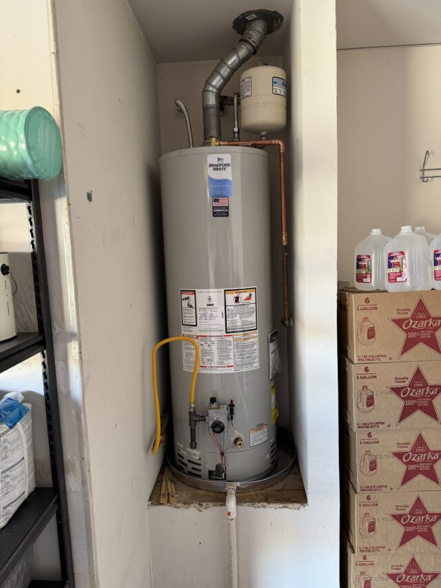 Newly installed 50-gallon Bradford White gas water heater in residential garage