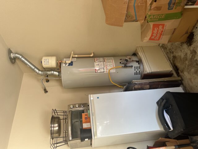 Completed installation of a 50-gallon Bradford White water heater in the garage