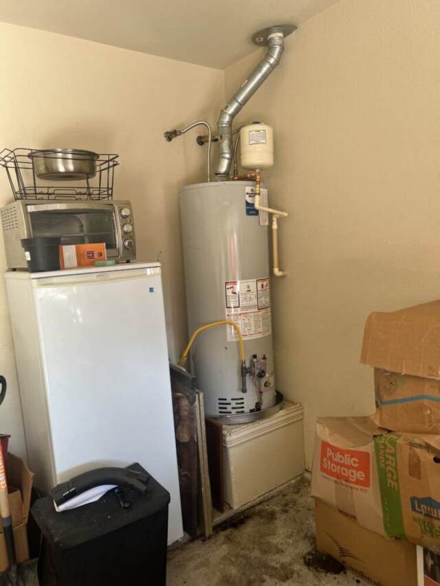 Completed installation of a 50-gallon Bradford White water heater in the garage