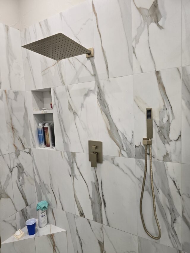 Beautiful gold accent shower trim kit installed