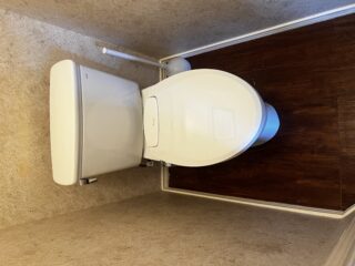 New white Bradford White 50-gallon gas water heater installed in Frisco home attic with blue expansion tank