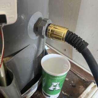BEFORE - Plastic drain valve on water heater