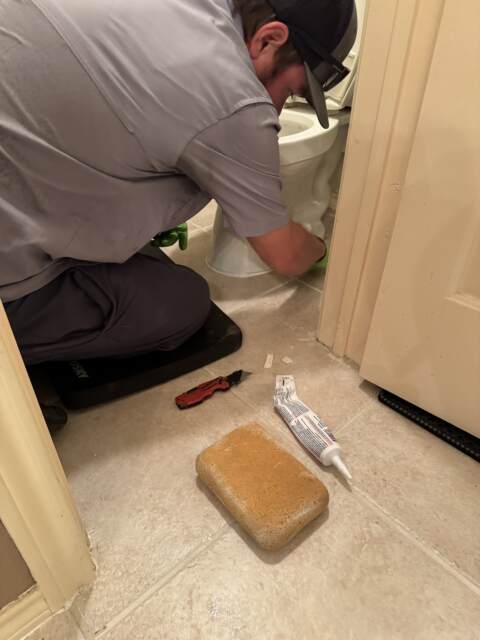 The toilet was removed and reset so we could replace the broken flange